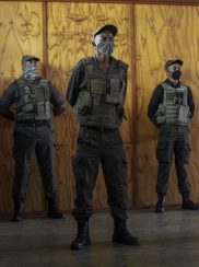 Security guards of the private security company CORTAC stand guards while briefed by their officer at one of CORTAC base before starting their night shift in Johannesburg, on February 17, 2021. - South Africa has one of the world's largest private security industries, employing more personnel than the police, according to the national Private Security Industry Regulatory Authority.
The sector creates work for more than two million people in a country where unemployment stands over 30 percent. (Photo by Michele Spatari / AFP)